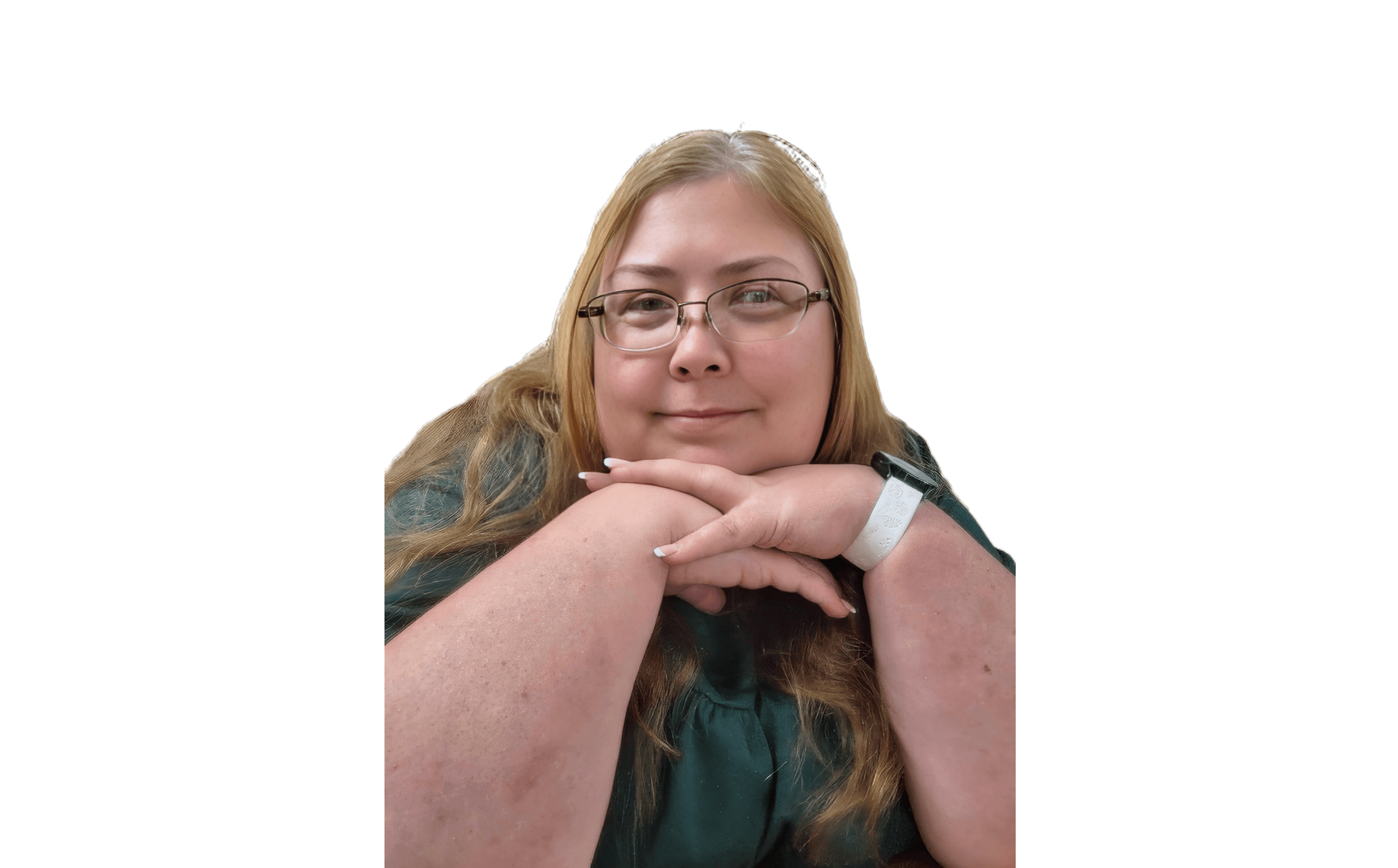 Smiling woman with glasses and long hair resting her chin on her hands, black background.